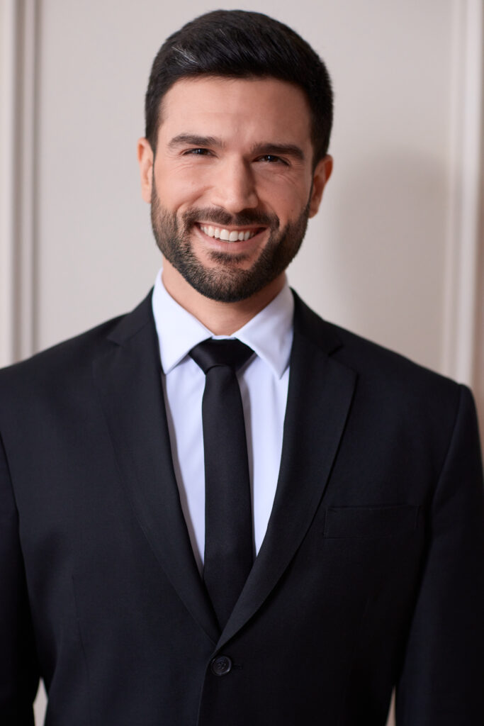 Markos Kandilis in a black suit