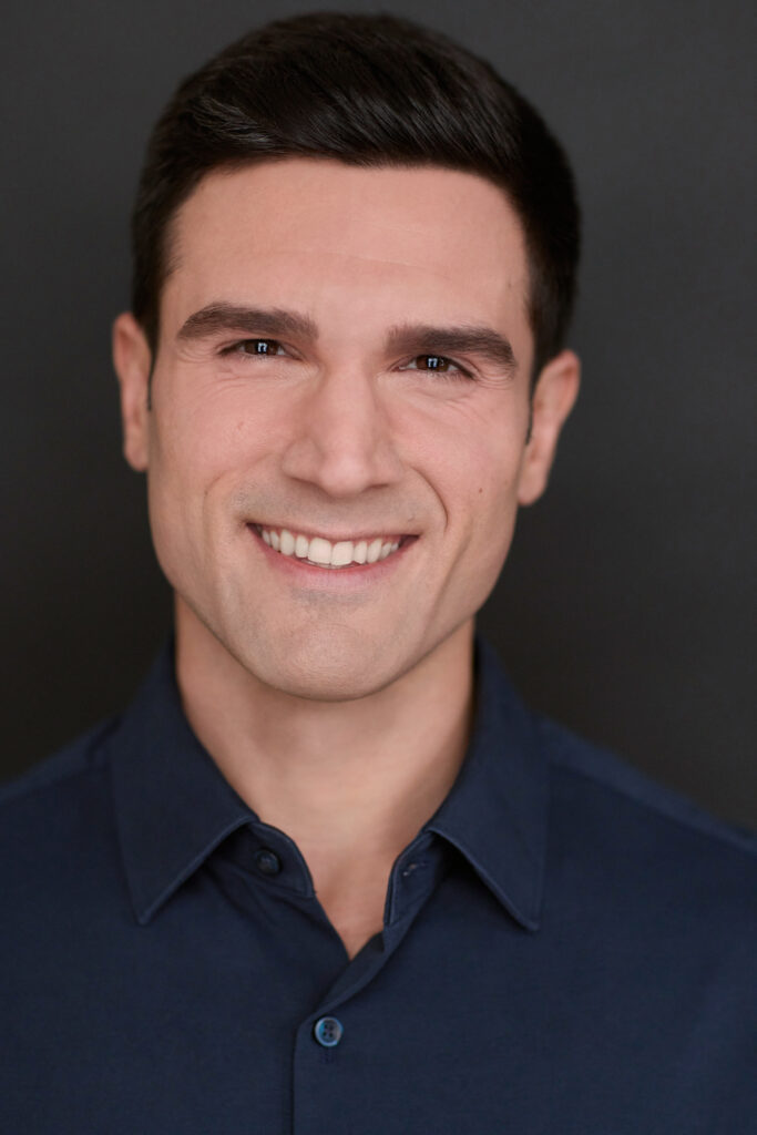 Markos Kandilis in a blue shirt