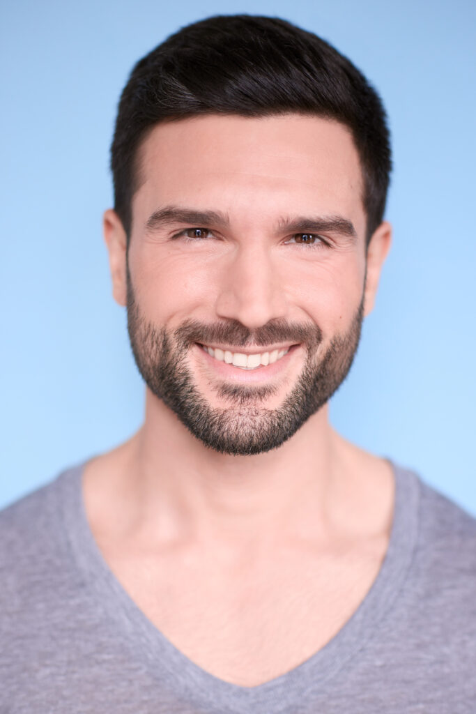 Markos Kandilis in a grey shirt