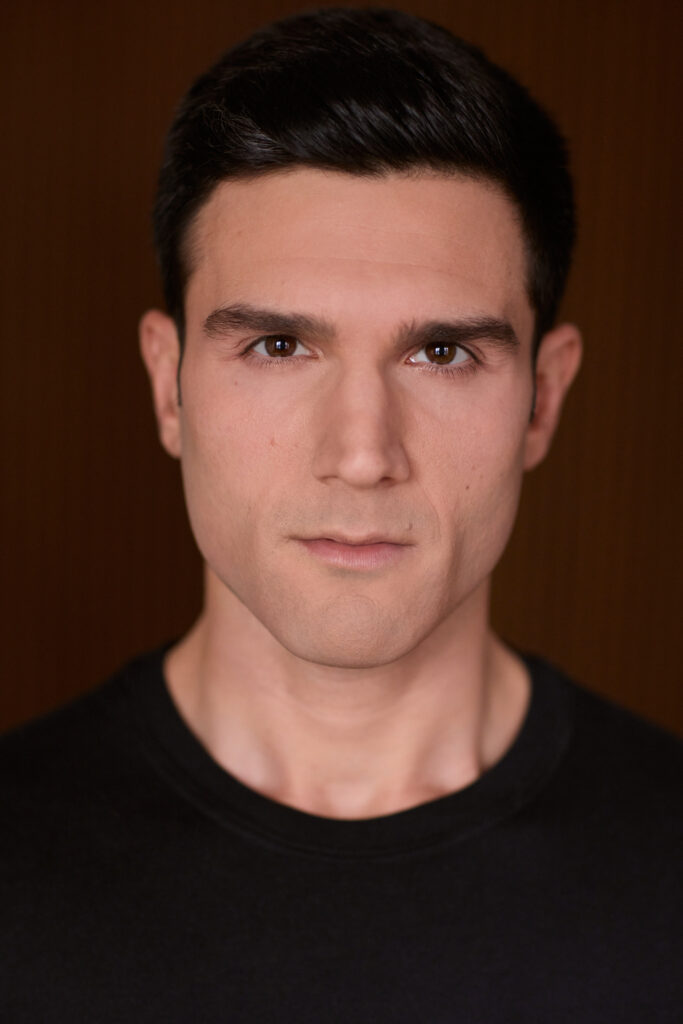 Markos Kandilis in a black shirt